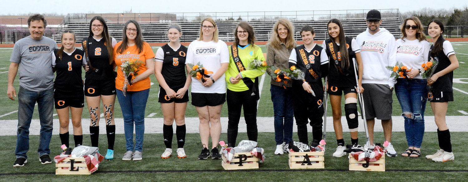 Owensville Dutchgirl soccer seniors (from left) pictured with their family members include Leah Reed (2), Paige Loyd (green jersey), Aubrey Dawson (22) and Jocelyn Benson (9).